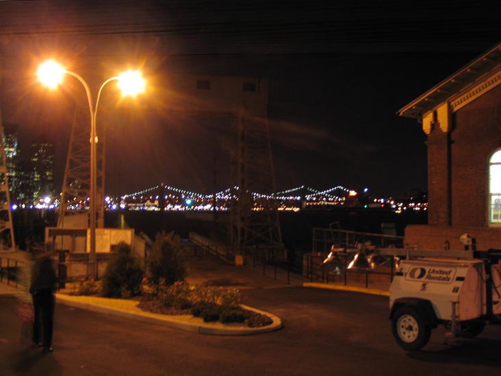 Governors Island Ferry Dock at Night, East River Bridges in Distance, New York City
