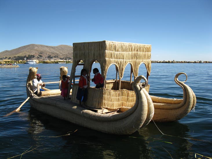 Wiñay Pacha Totora Reed Boat Leaving Isla Jacha Challwa, Uros Floating Islands, Puno Bay, Lake Titicaca/Lago Titicaca, Peru