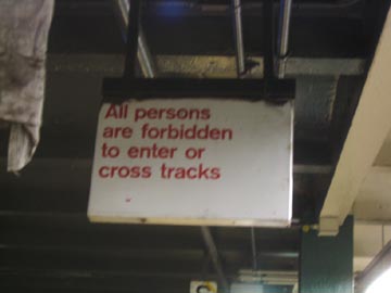 All persons are forbidden to enter or cross tracks