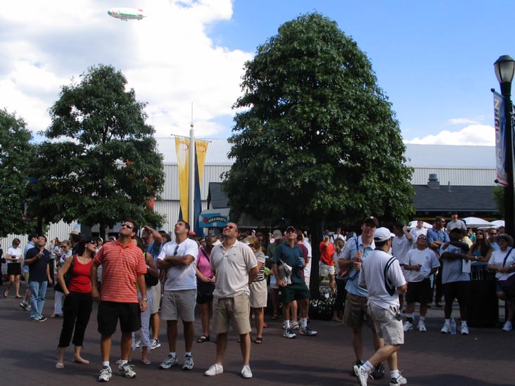 Spectators Watching Television Screen in Front of Louis Armstrong Stadium, 2005 US Open, September 3, 2005, Flushing Meadows Corona Park, Queens