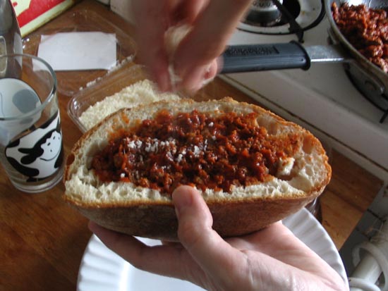 Sprinkling Parmigiano Reggiano On The Sloppy Giuseppe